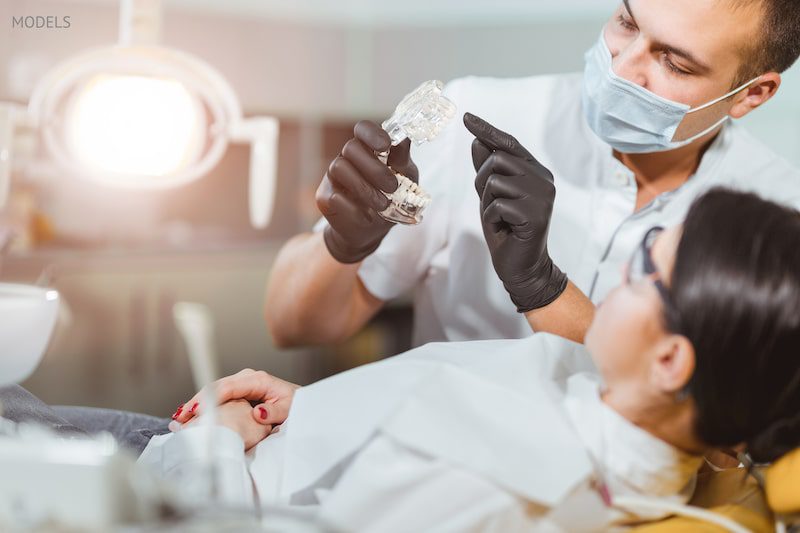 Woman getting a dental treatment during COVID.