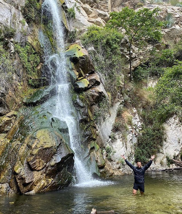 Dr. Navid by a waterfall